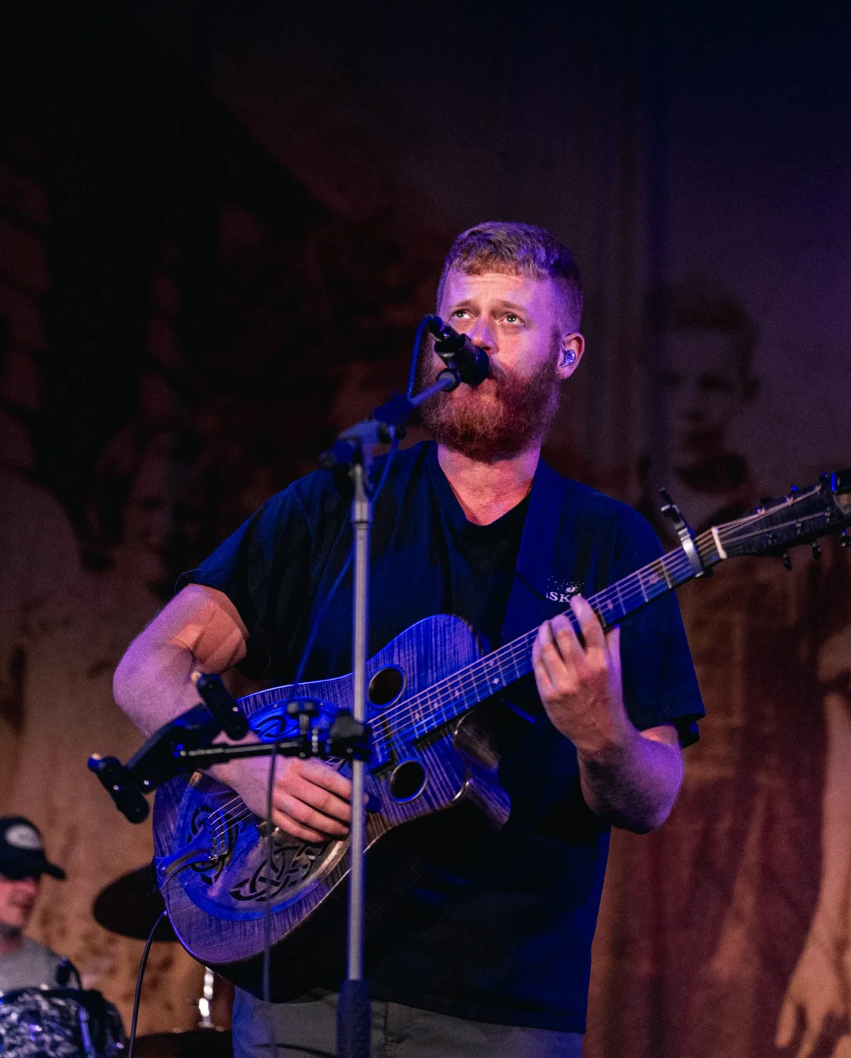 Oliver Anthony performing with guitar